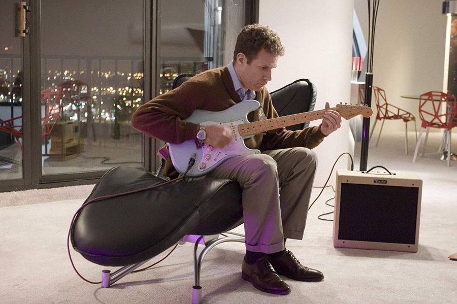 Will Ferrall playing an electric guitar in the film Stranger Than Fiction